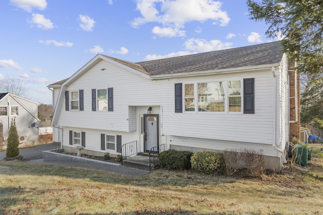 view of front of property with a front lawn