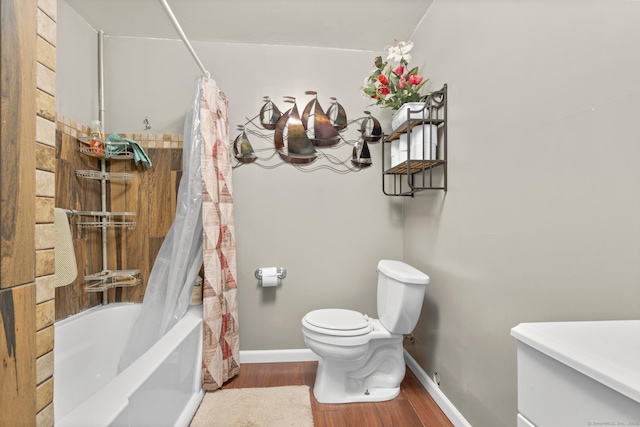 bathroom featuring toilet, hardwood / wood-style floors, and shower / bathtub combination with curtain