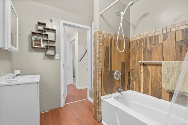 bathroom with vanity, shower / bathtub combination, and hardwood / wood-style floors