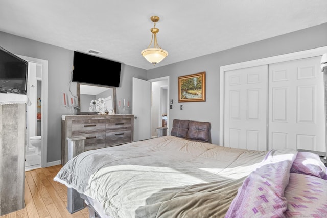 bedroom featuring light wood-type flooring and a closet