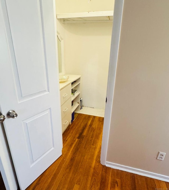 walk in closet featuring dark hardwood / wood-style flooring