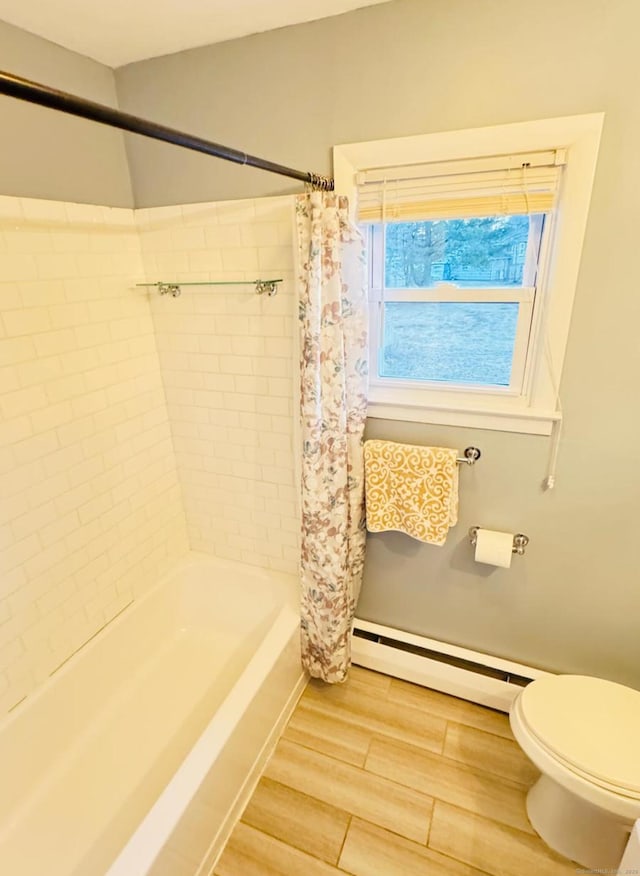 bathroom featuring shower / bath combination with curtain, toilet, and baseboard heating