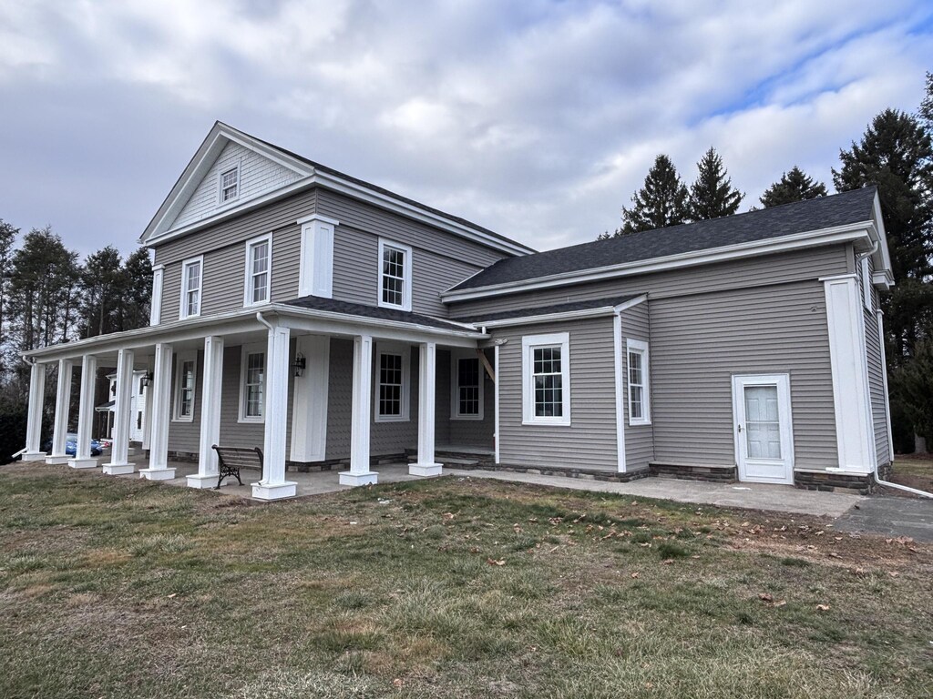 239 Windsorville Rd, Ellington, CT 06029 - view of front of property with covered porch and a front yard