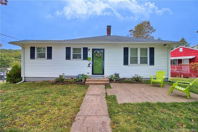 bungalow-style house with a patio area and a front yard