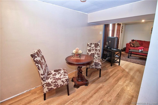 sitting room with hardwood / wood-style flooring