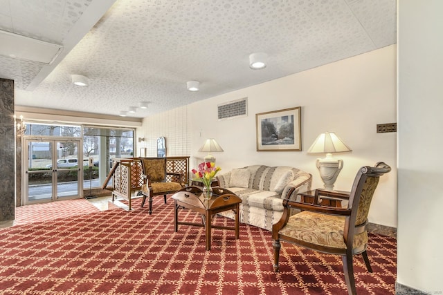 carpeted living room with french doors