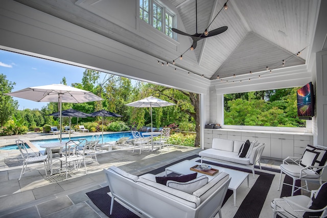 view of patio with ceiling fan and an outdoor hangout area