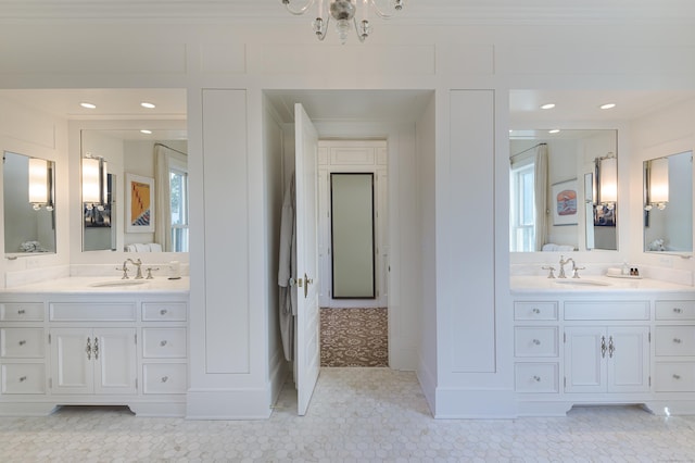 bathroom with crown molding, tile patterned floors, and vanity