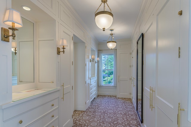 doorway featuring ornamental molding