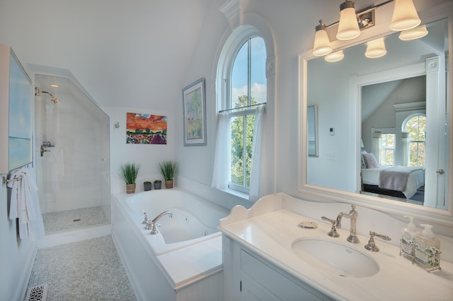 bathroom with vanity, vaulted ceiling, tile patterned floors, and plus walk in shower