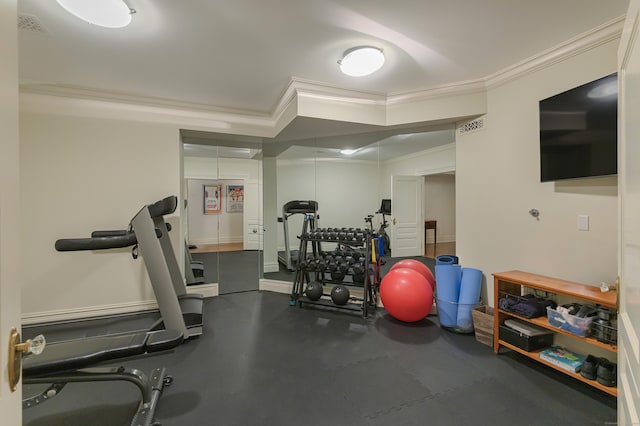 workout room with crown molding