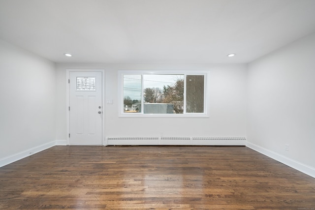 entryway with dark hardwood / wood-style floors and a baseboard radiator