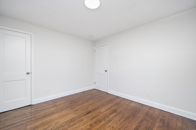 spare room featuring dark hardwood / wood-style floors