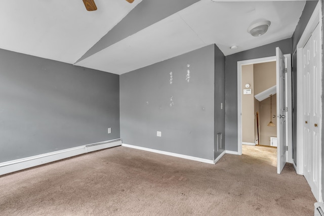 carpeted spare room with baseboard heating, ceiling fan, and lofted ceiling