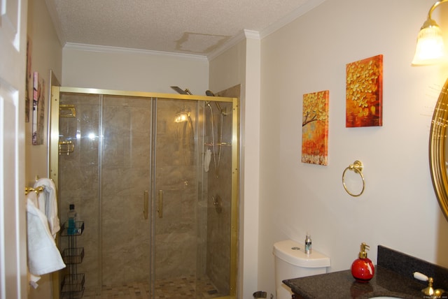 bathroom featuring a textured ceiling, ornamental molding, a shower with door, and vanity