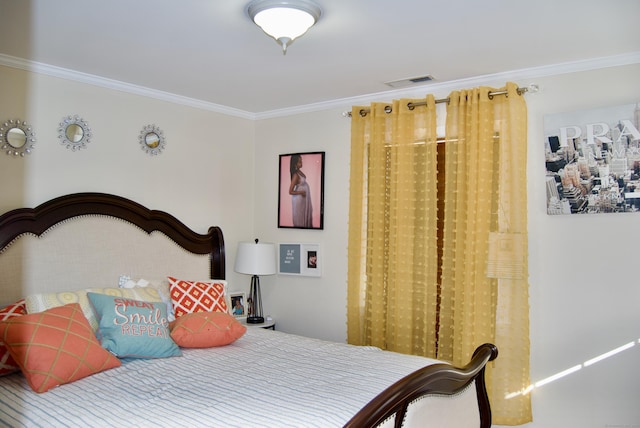 bedroom featuring crown molding