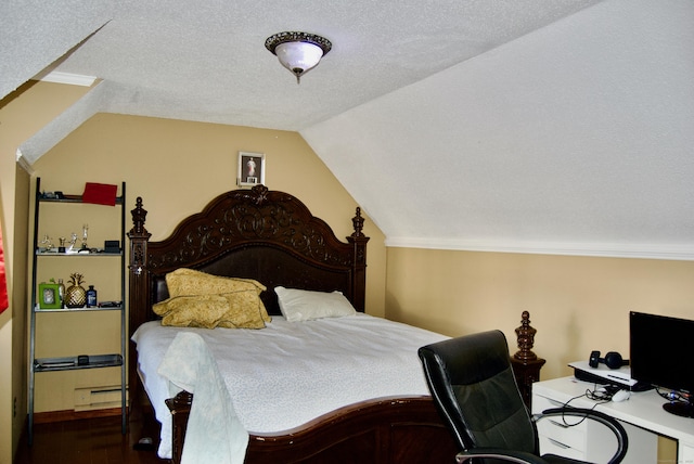 bedroom featuring baseboard heating, vaulted ceiling, crown molding, and a textured ceiling