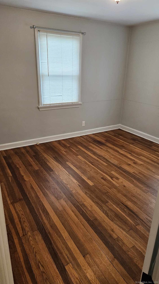 empty room featuring dark hardwood / wood-style floors