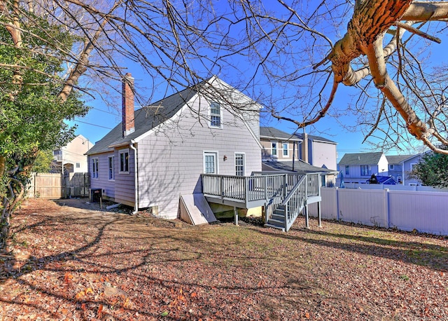 back of property featuring a deck