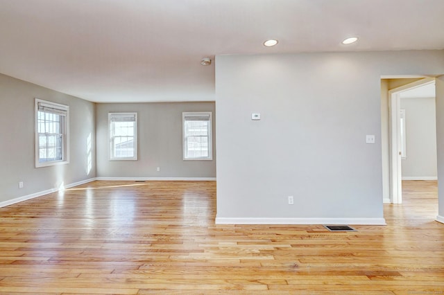 spare room featuring light hardwood / wood-style flooring