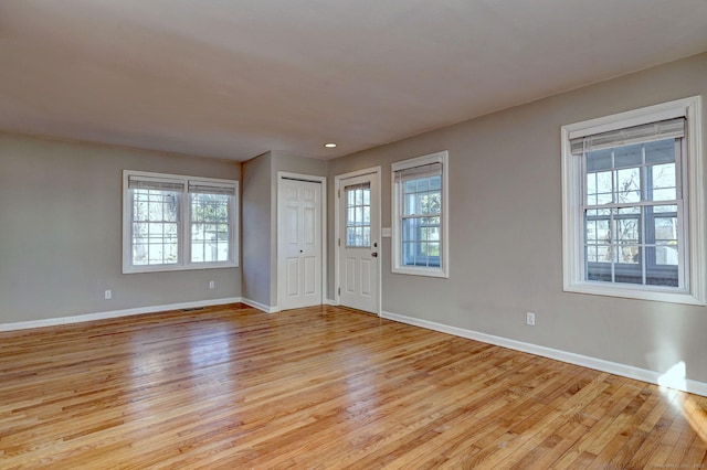 foyer with light hardwood / wood-style floors