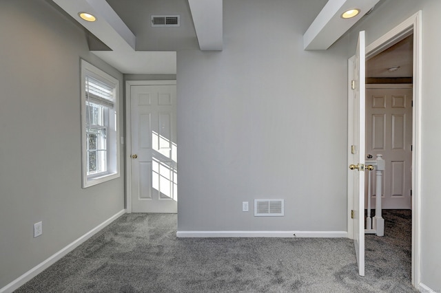 foyer with carpet flooring