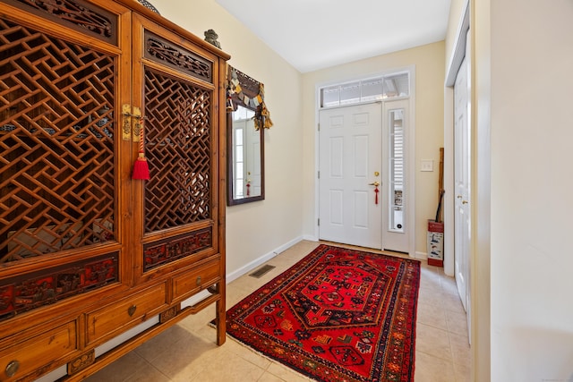 entrance foyer featuring light tile patterned flooring