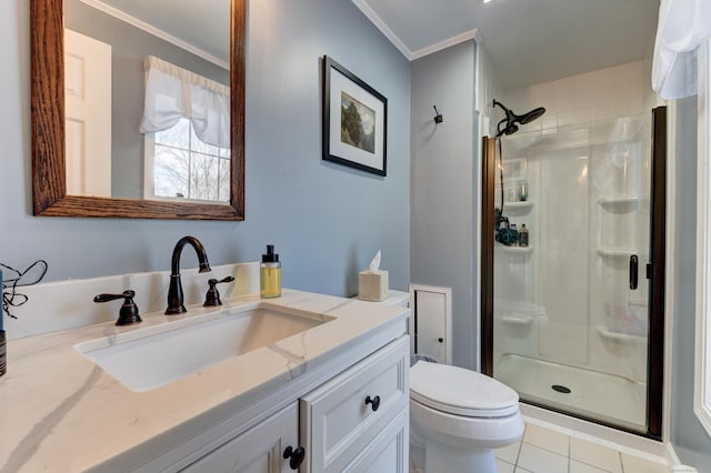 bathroom featuring crown molding, vanity, tile patterned floors, and a shower with shower door