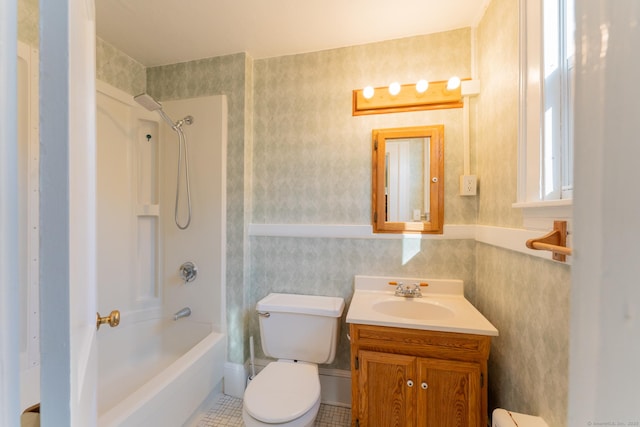 full bathroom featuring toilet, vanity, tile patterned floors, and shower / tub combination