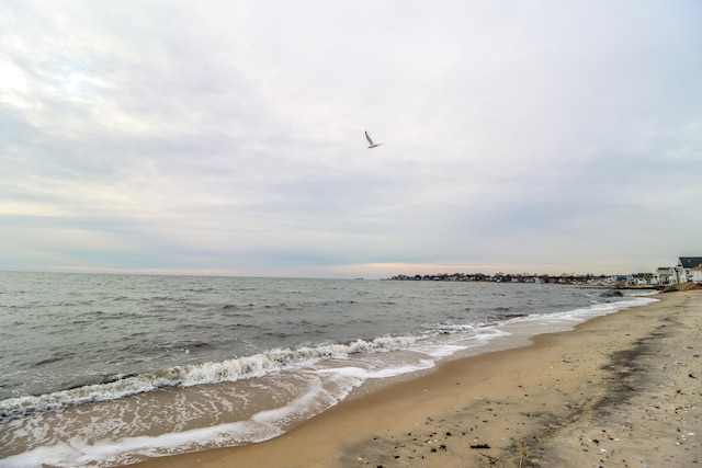 property view of water featuring a view of the beach