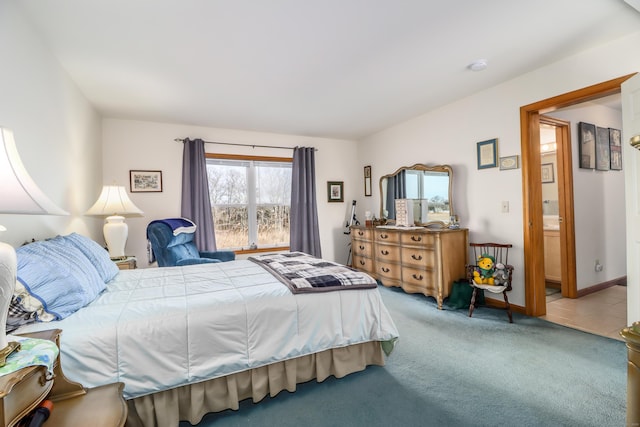 carpeted bedroom with ensuite bathroom