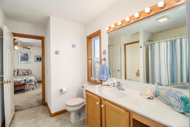 bathroom with toilet, ceiling fan, a shower with shower curtain, and vanity