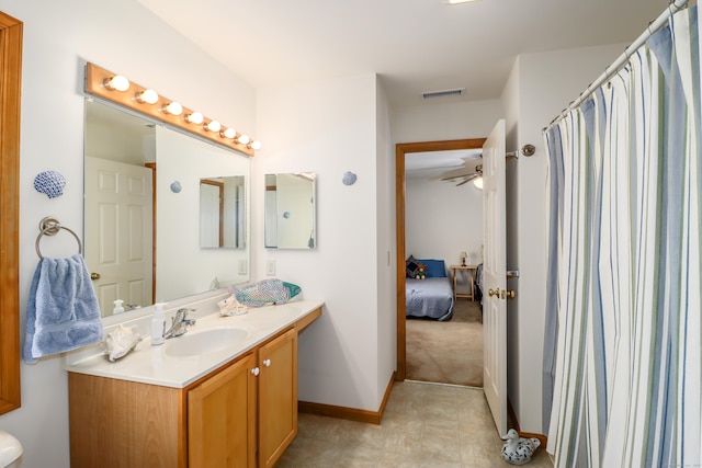 bathroom with ceiling fan and vanity