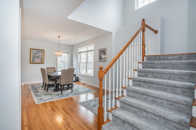 dining room with hardwood / wood-style flooring and a chandelier