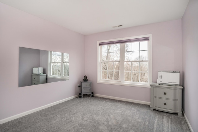 unfurnished room with light colored carpet