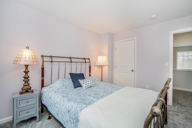 bedroom featuring light carpet