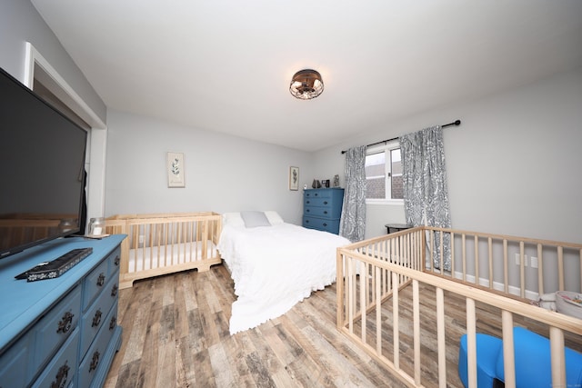 bedroom with light hardwood / wood-style floors