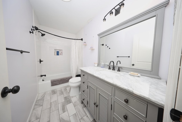 full bathroom featuring toilet, vanity, and shower / bath combo with shower curtain