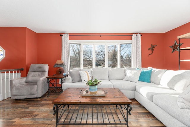 living room with plenty of natural light and hardwood / wood-style floors