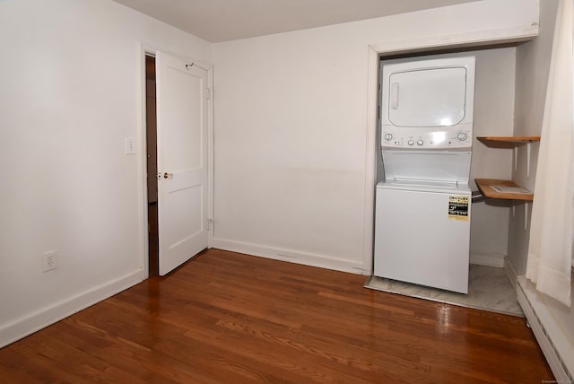 washroom with stacked washer and dryer and dark hardwood / wood-style flooring