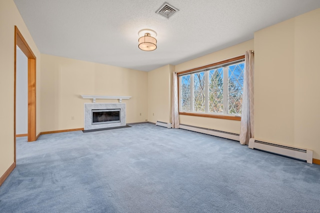 unfurnished living room featuring a fireplace, a textured ceiling, and a baseboard radiator