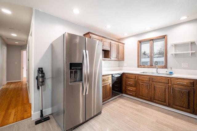 kitchen with stainless steel refrigerator with ice dispenser, wine cooler, sink, backsplash, and light wood-type flooring