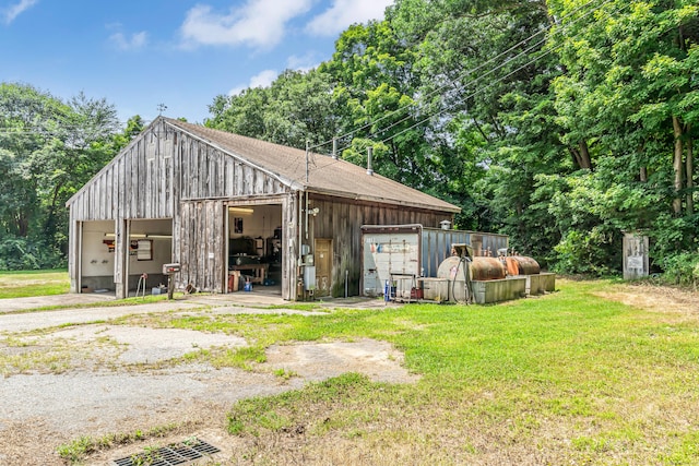 exterior space with a yard and a garage