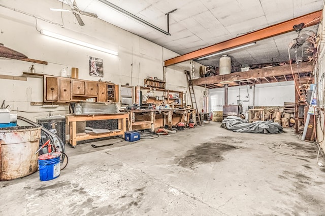 garage with ceiling fan and a workshop area