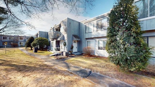 exterior space featuring a yard and central AC unit