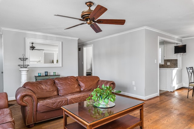 living room featuring hardwood / wood-style flooring and ornamental molding