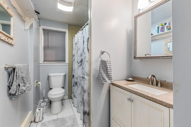 bathroom with toilet, a shower with curtain, tile patterned floors, and vanity