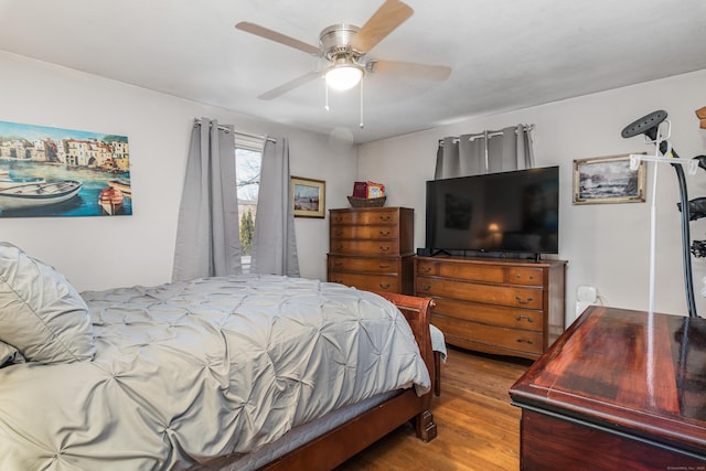 bedroom featuring ceiling fan and hardwood / wood-style flooring