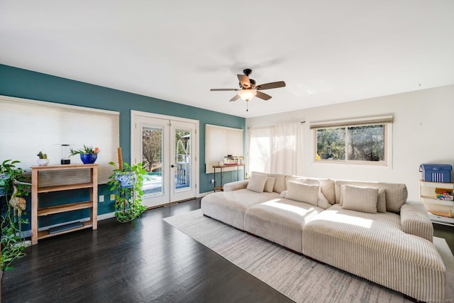 living room with ceiling fan, dark hardwood / wood-style flooring, and french doors