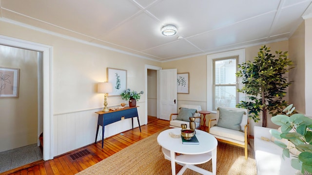 sitting room with hardwood / wood-style flooring